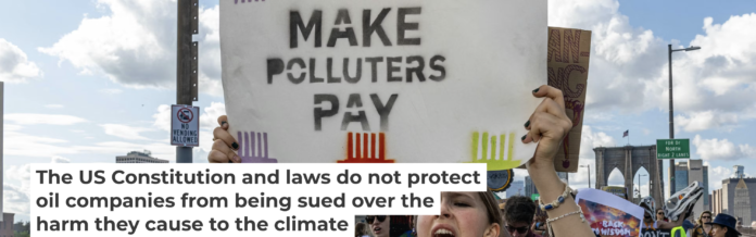 Across the U.S., people are calling for companies to pay for the damage they have done to the environment. Alex Kent/AFP via Getty Images